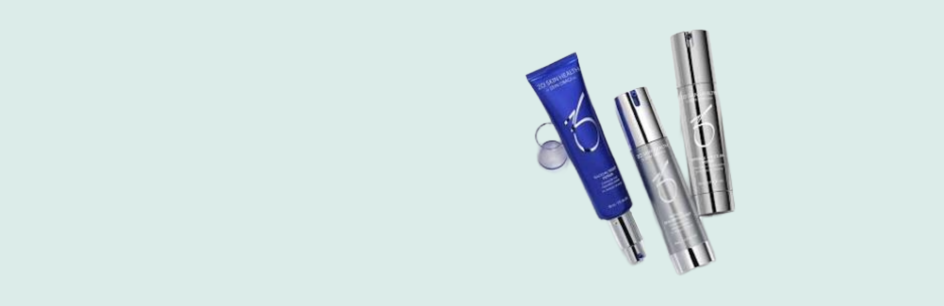 Skincare products including a blue tube, silver bottles, and a silver container on a light blue background